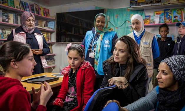 UNHCR Special Envoy Angelina Jolie talks to Syrian children at Za’atari camp in Jordan.  © UNHCR/Ivor Prickett