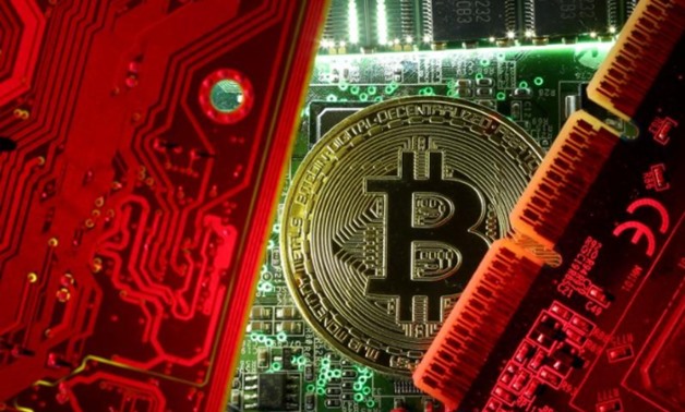 FILE PHOTO: A copy of bitcoin standing on PC motherboard is seen in this illustration picture, October 26, 2017. REUTERS/Dado Ruvic/File Photo
