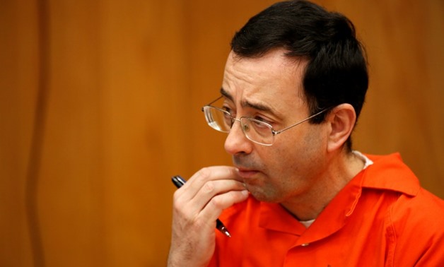 Former USA Gymnastics doctor Larry Nassar, seen here at a sentencing hearing in Charlotte, Michigan, has pleaded guilty to sexually abusing young female athletes - AFP 
