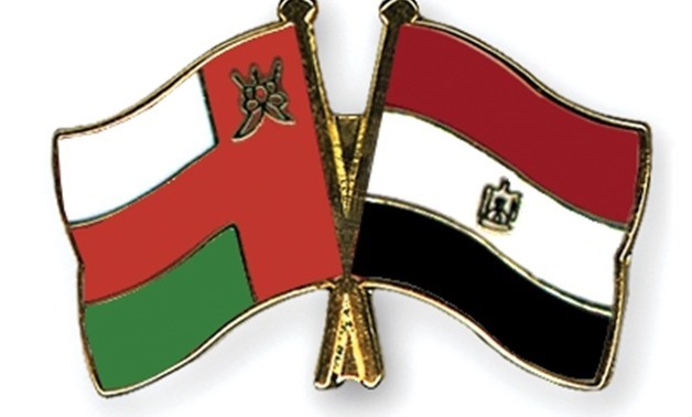FILE- Crossed Flag-Pins of Oman and Egypt