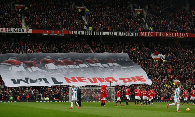 Soccer Football - Premier League - Manchester United vs Huddersfield Town - Old Trafford, Manchester, Britain - February 3, 2018 Manchester United fans display banner in remembrance of the Munich air disaster Action Images via Reuters/Lee Smith 
