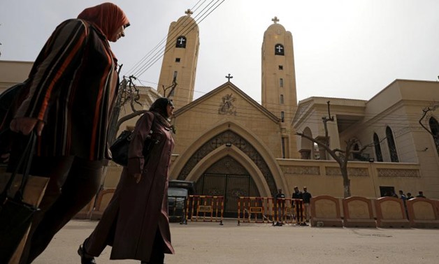Women pass by the Coptic church that was bombed on Sunday in Tanta, Egypt, April 10, 2017- Reuters/Mohamed Abd El Ghany