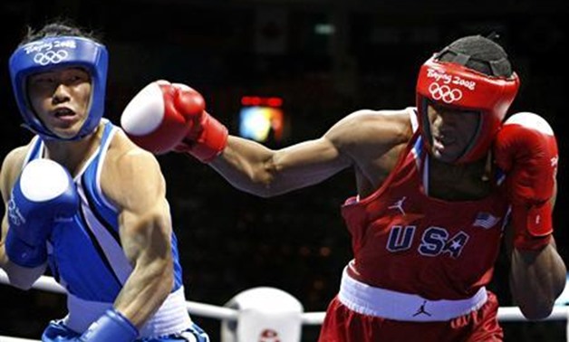 Kim Jungjoo (L) of Korea fights Demetrius Andrade of the U.S. during the men's welterweight (69kg) quarter-final boxing match at the Beijing 2008 Olympic Games August 17, 2008. REUTERS/Lee Jae-Won