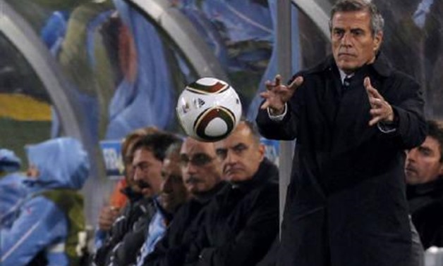 : Uruguay's head coach Oscar Washington Tabarez catches the ball during a 2010 World Cup Group A, Reuters