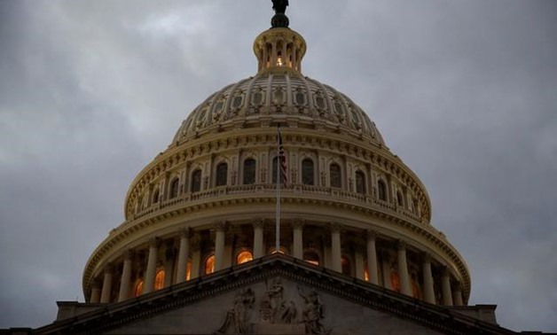 FILE PHOTO: The U.S. Capitol building is lit at dusk in Washington, U.S., December 18, 2017. REUTERS/Joshua Roberts/Files. “
