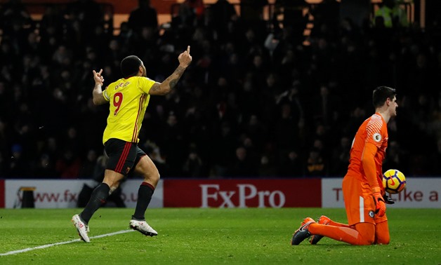 Soccer Football - Premier League - Watford vs Chelsea - Vicarage Road, Watford, Britain - February 5, 2018 Watford's Troy Deeney celebrates scoring their first goal as Chelsea's Thibaut Courtois looks dejected REUTERS/David Klein
