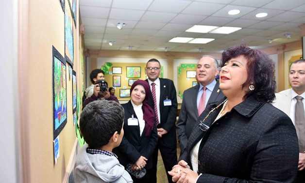 Minister of Culture Inas Abdel-Dayem looks at children's art work Feb. 5, 2018 - Photo courtesy of Cairo Opera House 