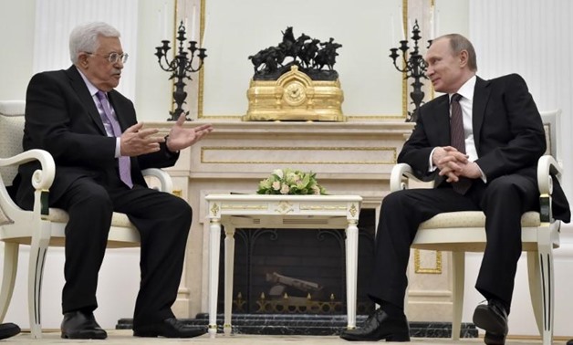 FILE PHOTO - Russian President Vladimir Putin (R) meets with Palestinian President Mahmoud Abbas at the Kremlin in Moscow, Russia, April 18, 2016. REUTERS/Alexander Nemenov/Pool