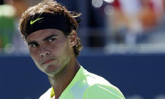 Rafael Nadal of Spain reacts to losing a point against Mikhail Youzhny of Russia during the U.S. Open tennis tournament in New York, September 11, 2010. REUTERS/Mike Segar