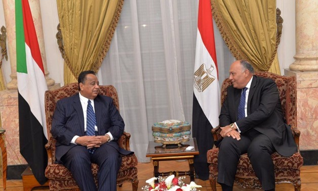 Foreign Minister Sameh Shoukry with his Sudanese counterpart, Ibrahim Ghandour in Cairo on Feb. 8, 2018 - Press photo