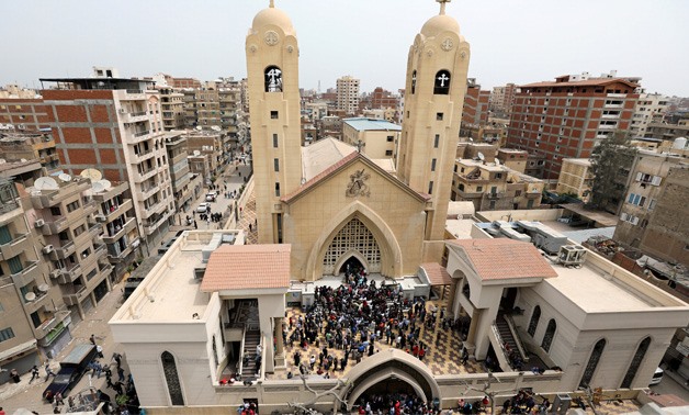 Egyptians gather by a Tanta's church that was bombed on Sunday- Reuters 