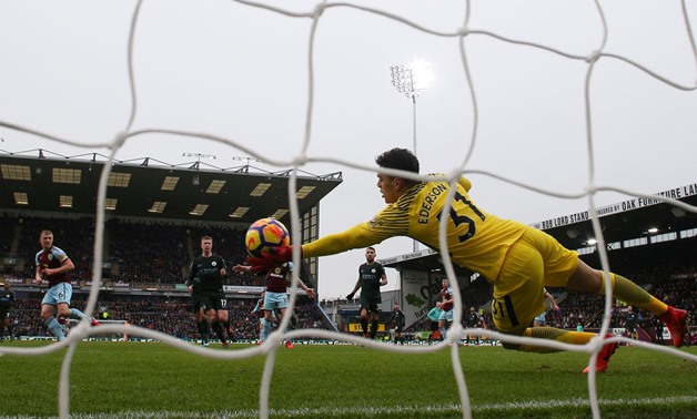 Soccer Football - Premier League - Burnley vs Manchester City - Turf Moor, Burnley, Britain - February 3, 2018 Manchester City's Ederson makes a save from Burnley's Ben Mee Action Images via Reuters/Jason Cairnduff 