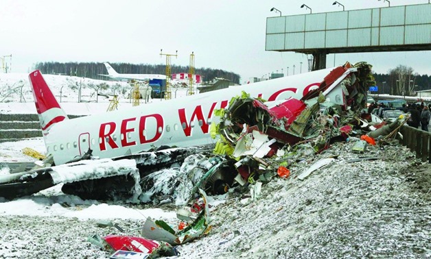 An aircraft wreckage lies next to a highway near Moscow’s Vnukovo Airport Sunday December 30, 2012 - (REUTERS/Mikhail Voskresensky)