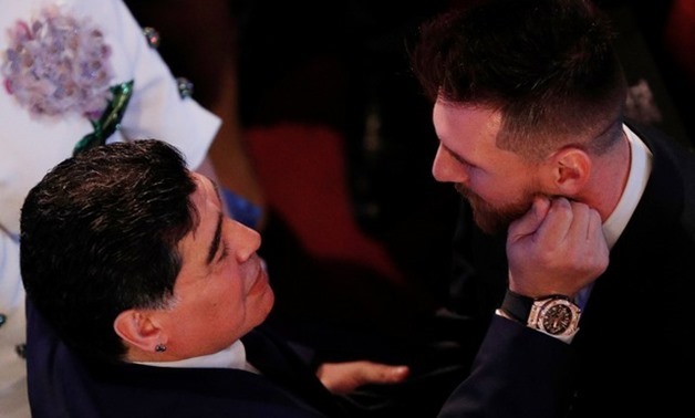 Barcelona’s Lionel Messi speaks with former Argentinian player Diego Maradona before the start of the awards – Action Images via Reuters