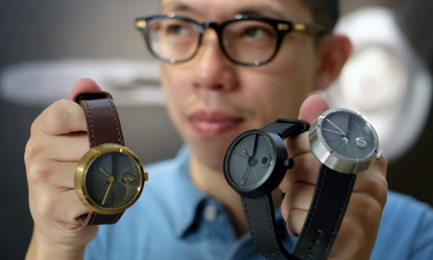 Jewellery and watchmaker Sean Yu creates watches made with a cement surface that are a huge hit with Taiwan's consumers - AFP / SAM YEH