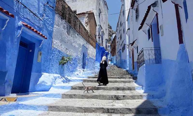 Huddling against a hillside in northern Morocco is Chefchaouen, a tourist town famed for the striking blue of its buildings - AFP