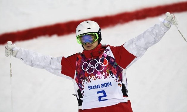 FILE PHOTO: Canada's Mikael Kingsbury reacts during the men's freestyle skiing moguls qualification round at the 2014 Sochi Winter Olympic Games in Rosa Khutor February 10, 2014. REUTERS/Dylan Martinez
