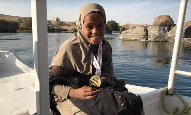 FILE - Marwa smiles after winning the gold medal