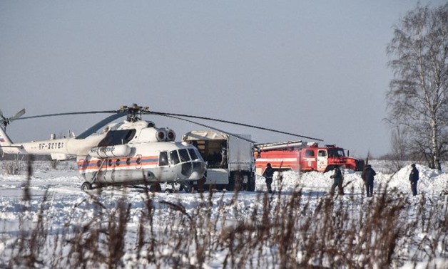 Rescue work was made difficult by deep snow in the field where the Antonov An-148 plane went down near Moscow
