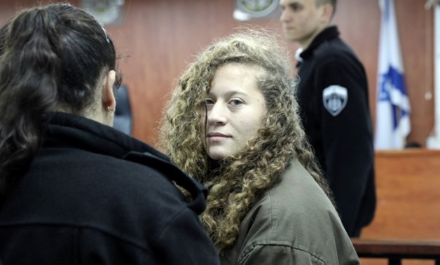 Palestinian teen Ahed al-Tamimi enters an Israeli military courtroom in January (Reuters)
