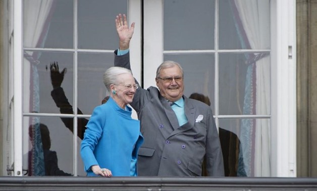FILE PHOTO: Denmark's Queen Margrethe and Prince Henrik wave from the balcony during Queen Margrethe's 76th birthday celebration at Amalienborg Palace in Copenhagen, Denmark April 16, 2016. REUTERS/Marie Hald/Scanpix/File Photo