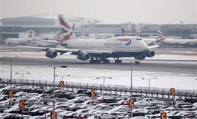 A British Airways aircraft takes off after snowfall at Heathrow airport in London January 21, 2013 -
 REUTERS/Neil Hall
