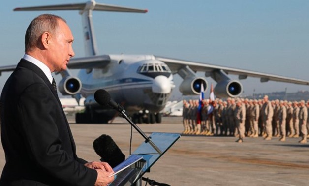 FILE - In this file photo taken on Tuesday, Dec. 12, 2017, Russian President Vladimir Putin addresses the troops at the Hemeimeem air base in Syria. Several private Russian military contractors were killed by a U.S. strike in Syria, Russian media reported