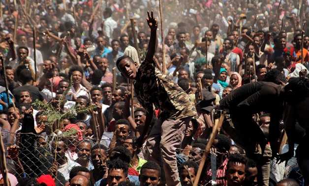 Supporters of Bekele Gerba, secretary general of the Oromo Federalist Congress (OFC), chant slogans to celebrate Gerba's release from prison, in Adama, Oromia Region, Ethiopia February 14, 2018. REUTERS/Tiksa Negeri