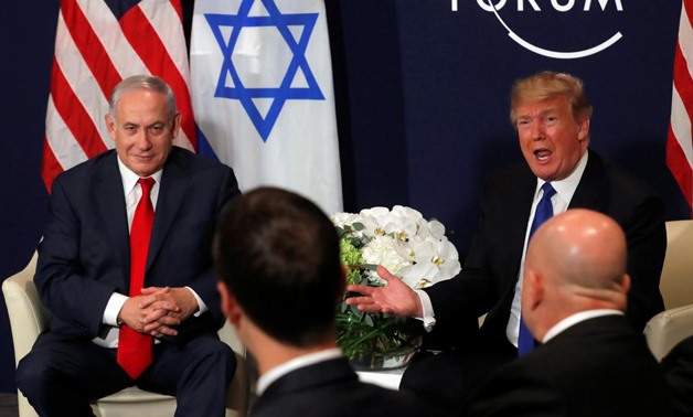 FILE PHOTO - U.S. President Donald Trump speaks with Israeli Prime Minister Benjamin Netanyahu during the World Economic Forum (WEF) annual meeting in Davos, Switzerland January 25, 2018. REUTERS/Carlos Barria