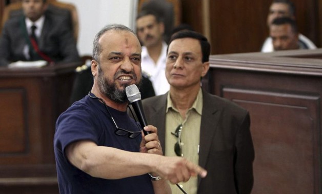 Member of the Muslim Brotherhood Mohamed Beltagy speaks during his trial at a court in Cairo, May 18, 2014 - Reuters
