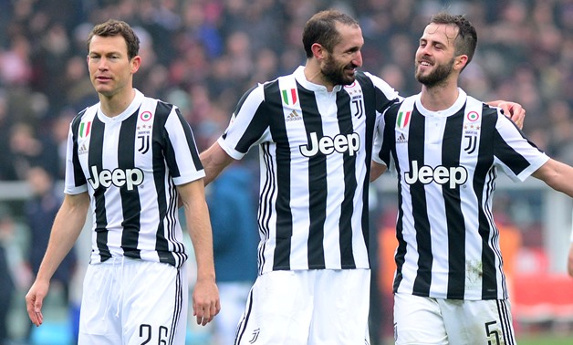 Soccer Football - Serie A - Torino vs Juventus - Stadio Olimpico Grande Torino, Turin, Italy - February 18, 2018 Juventus’ Giorgio Chiellini, Miralem Pjanic and Stephan Lichtsteiner celebrate in front of their fans at the end of the match REUTERS/Massimo 