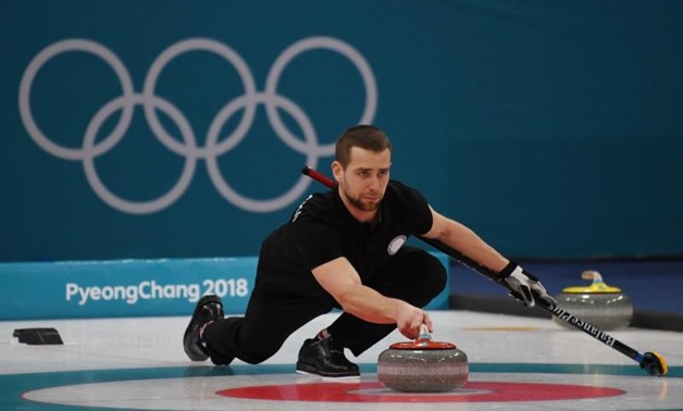 Feb 13, 2018; Gangneung, South Korea; Aleksandr Krushelnitckii (OAR) during the mixed doubles curling bronze medal game during the Pyeongchang 2018 Olympic Winter Games at Gangneung Curling Centre. Mandatory Credit: James Lang-USA TODAY Sports