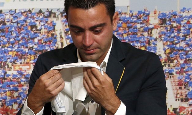 Barcelona's Xavi Hernandez cries during his farewell event at Auditori 1899 in Nou Camp stadium in Barcelona, Spain, June 3, 2015 - REUTERS/Gustau Nacarino