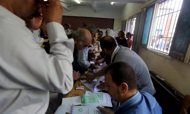 Egyptians cast their votes during parliamentary elections at a voting center in Giza governorate, Egypt, October 18, 2015. REUTERS/Mohamed Abd El Ghany