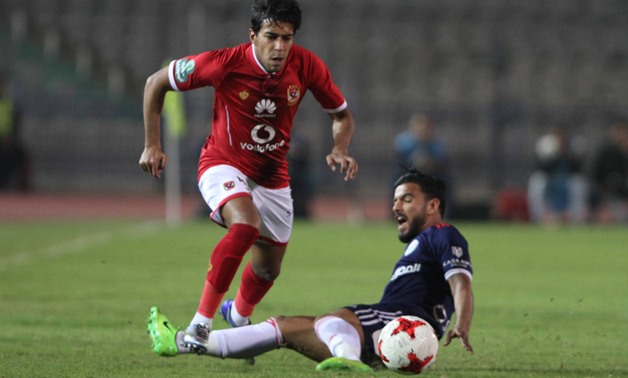 Soccer, Egyptian League, Feb, 19, 2018, Al Ahly’s Ahmed Hamoudi dribbles Al Nasr defender during the first half, Egypt Today, Hassan Mohamed 