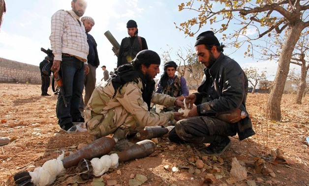 Free Syrian Army fighters preparing mortars to fire at forces loyal to President Bashar al-Assad. Credit Molhem Barakat-Reuters