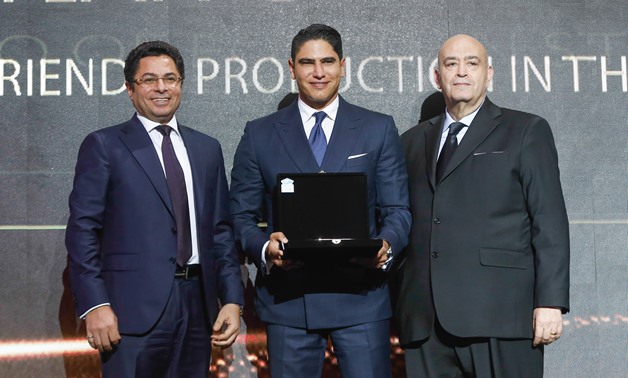 Ahmed Abou Hashima receiving his award in the bt100 Awards ceremony - Egypt Today