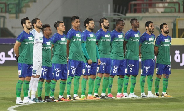 Al-Ahly vs. Misr el-Makasa. Misr el-Makasa players pose for a moment of silence, December 10, 2017 – Egypt Today 