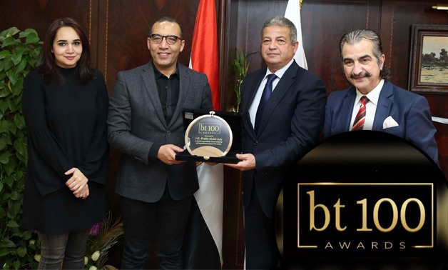 Minister of Youth and Sports Khaled Abdel Aziz receiving BT100's shield of honor by BT head of the editorial board Khaled Salah – Egypt Today/Hossam Atef