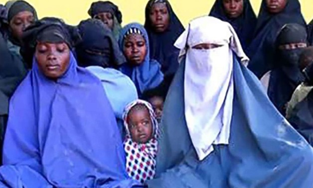 In this video grab made, Jan. 15, 2018, from a video released the same day by Islamist militant group Boko Haram shows at least 14 of the schoolgirls abducted from the northeast Nigerian town of Chibok in April 2014 - AFP 