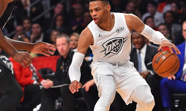 February 18, 2018; Los Angeles, CA, USA; Team LeBron guard Russell Westbrook of the Oklahoma City Thunder (0) controls the ball against Team Stephen center Joel Embiid of the Philadelphia 76ers (21) during the second half of the 2018 NBA All Star Game at 