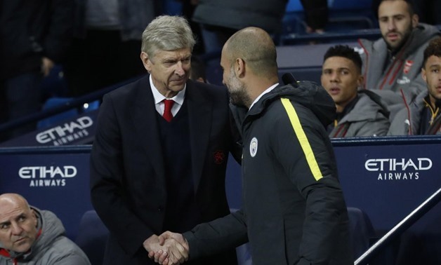 Britain Football Soccer - Manchester City v Arsenal - Premier League - Etihad Stadium - 18/12/16 Manchester City manager Pep Guardiola with Arsenal manager Arsene Wenger before the match Action - Reuters / Carl Recine
