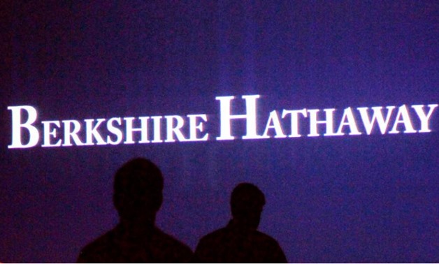 FILE PHOTO: Berkshire Hathaway shareholders walk by a video screen at the company's annual meeting in Omaha, Nebraska, U.S., May 4, 2013. REUTERS/Rick Wilking/File Photo
