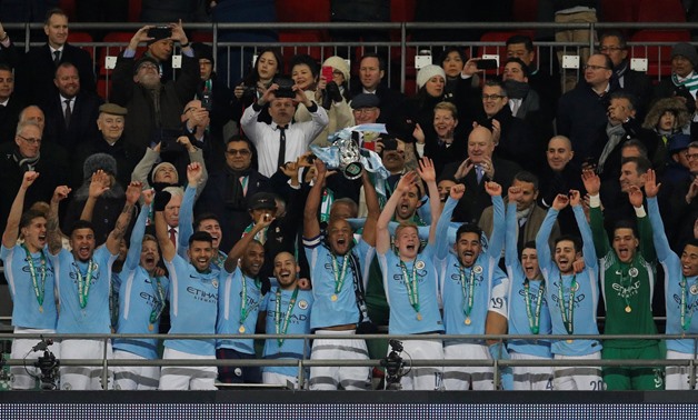 Soccer Football - Carabao Cup Final - Arsenal vs Manchester City - Wembley Stadium, London, Britain - February 25, 2018 Manchester City's Vincent Kompany lifts the trophy as they celebrate winning the Carabao