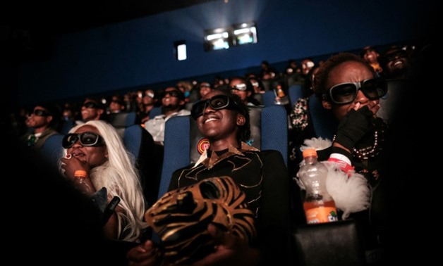 Cosplayers watch a screening of the smash hit "Black Panther" in 3D in Nairobi, Kenya