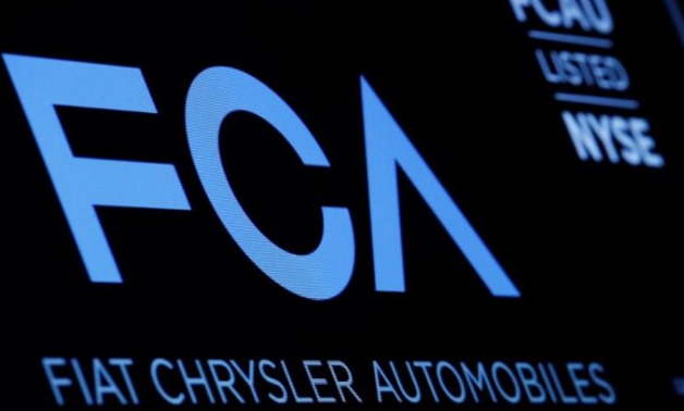 FILE PHOTO - A screen displays the ticker information for Fiat Chrysler Automobiles NV at the post where it's traded on the floor of the New York Stock Exchange (NYSE) in New York City, U.S., January 12, 2016. REUTERS/Brendan McDermid

