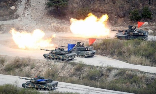 South Korean Army K1A1 and U.S. Army M1A2 tanks fire live rounds during a U.S.-South Korea joint live-fire military exercise, at a training field, near the demilitarized zone, separating the two Koreas in Pocheon, South Korea April 21, 2017. Picture taken