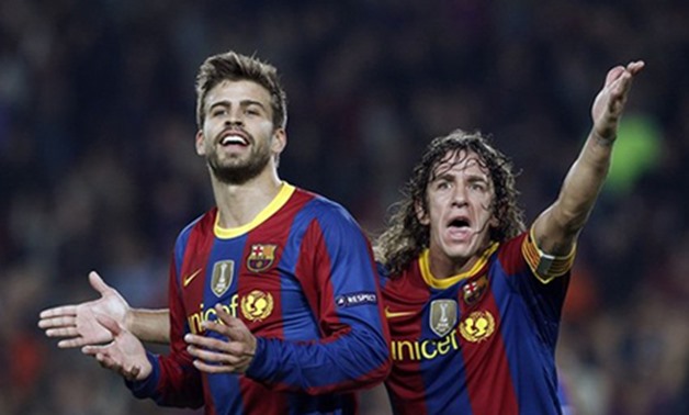 Barcelona's Gerard Pique (L) and Carles Puyol react after the annulment of Lionel Messi's goal against FC Copenhagen during their Champions League Group D soccer match at Nou Camp stadium in Barcelona October 20, 2010. REUTERS/Albert Gea 