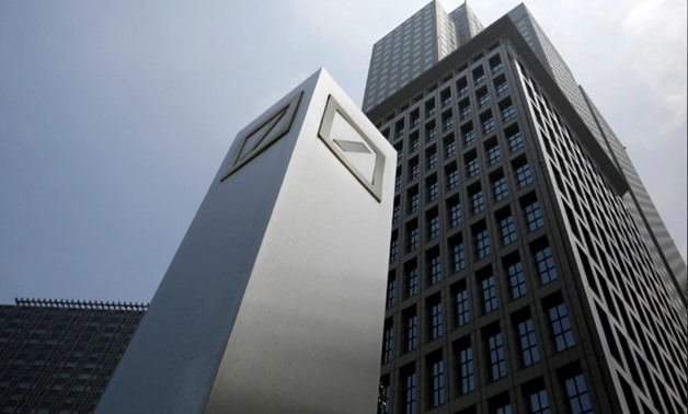 FILE PHOTO: Logos of Deutsche Bank AG are seen in Tokyo July 16, 2014. REUTERS/Toru Hanai/File Photo
