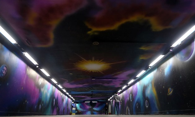 A group of 11 young artists that goes by the name of “Mobde'oon” (Innovators), color Cairo’s Opera metro station walls to represent the solar system - Mohamed al-Hosary